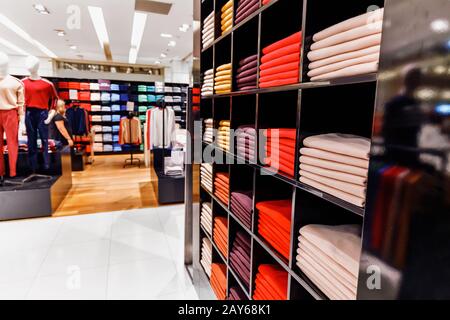 In The Mall selling stacks of clothing and fabric Stock Photo
