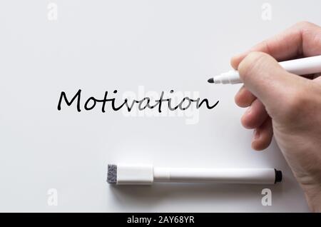 Motivation written on whiteboard Stock Photo