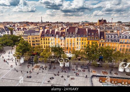 Aerial view of Pompidou square and residential houses. Eiffel tower at the distance. Paris travel and lifestyle concept Stock Photo