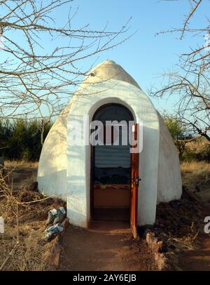 Camp huts hard serving of rooms in a hotel Tanzania Stock Photo