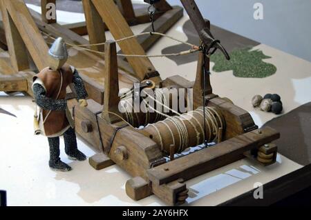 machine used in medieval siege warfare for hurling large stones or other missiles. Stock Photo