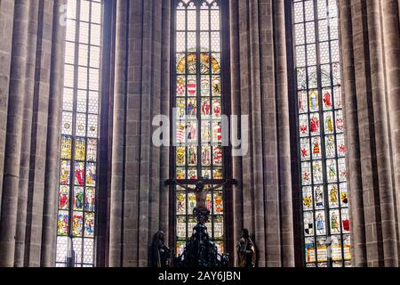 05 August 2019, Nuremberg, Germany: Interior of Saint Sebaldus church in Nuremberg with stained glass Stock Photo