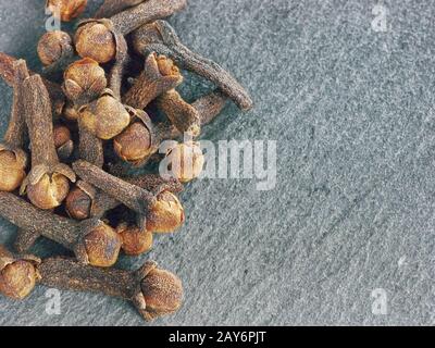 Cloves spice on gray slate background, copy space Stock Photo