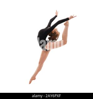 Young gymnast in elegant jump studio shot Stock Photo