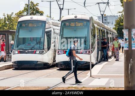 22 July 2019, Strasbourg, France: Modern city tram and passengers on the streets of Strasbourg Stock Photo