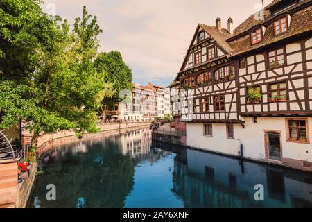 Strasbourg cityscape at sunset. Famous Petite France quartier and it's reflections in Ill river Stock Photo