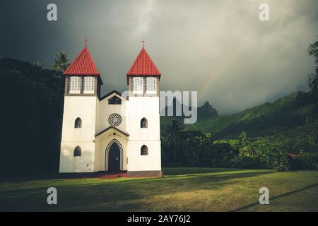 Rainbow on Haapiti church in Moorea island, landscape Stock Photo