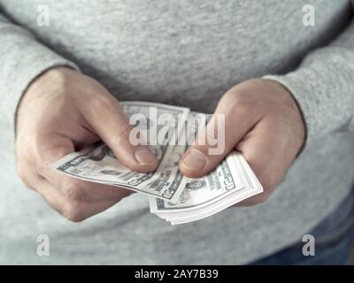 Hands counting dollars Stock Photo