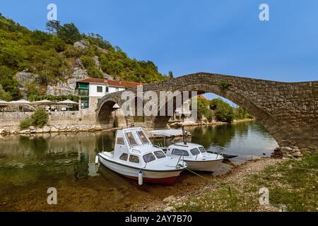 Old Bridge in Rijeka Crnojevica River near Skadar Lake - Montenegro Stock Photo
