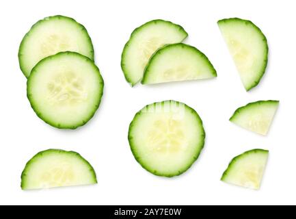 Fresh cucumber slices isolated on white background. Flat lay, top view. Light shadow Stock Photo