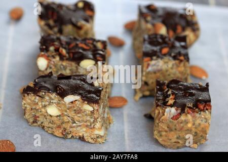 Granola bar with peanut butter. fit baton. Homemade bar with nuts and seeds.Healthy sweets. Almond bar. Stock Photo