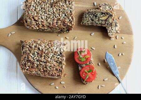 Delicate and crunchy bread. Gluten-free bread. Crunchy and tasty bread. Healthy bread. Seed and nut bread. Multi grain bread. Stock Photo