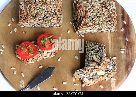 Delicate and crunchy bread. Gluten-free bread. Crunchy and tasty bread. Healthy bread. Seed and nut bread. Multi grain bread. Stock Photo