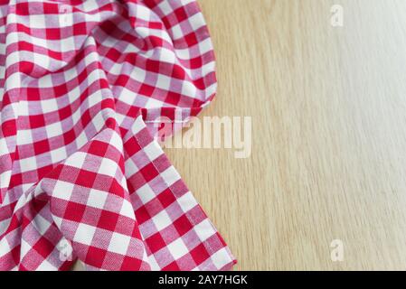 Checked tablecloth is on the wooden table Stock Photo