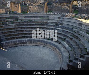 Syria, Shahba (known in Late Antiquity as Philippopolis). View of the theatre faced with basalt blocks. 3rd century. Photo taken before the Syrian civil war. Stock Photo