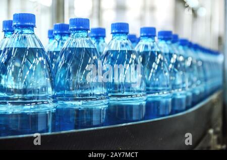 Closeup on mineral water bottles in raw and lines Stock Photo