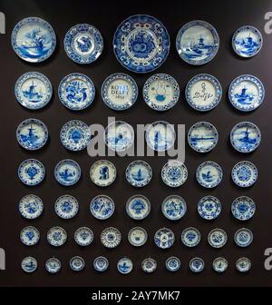 Delft, the Netherlands,January 18, 2020: Pottery masterpieces handmade painting porcelain at the Royal Delft pottery manufacture museum entrance hall Stock Photo