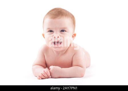 cute happy baby boy in diaper lies Stock Photo