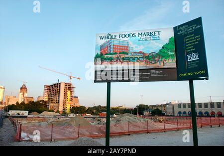Austin, TX: July 21, 2003. The skyline of Austin in the evening from the corner of 6th and Lamar Blvd. showing new construction with the Austin City Lofts in the foreground and the new convention center Hilton Hotel in the far background. This is the site of the new Whole Foods world headquarters and flagship store. Austin is still growing despite the sluggish U.S. economy.  ©Bob Daemmrich Stock Photo