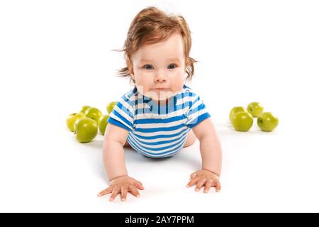 child in striped vest on the floor Stock Photo