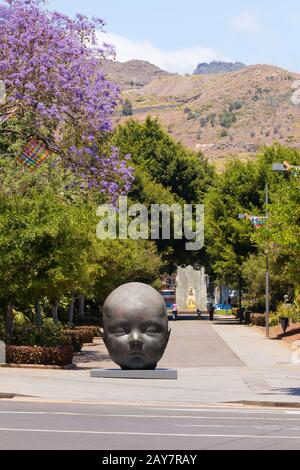 baby head sculpture with closed eyes in the gardens of Santa Cruz of Tenerife Stock Photo