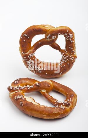 Bavarian pretzel with salt on white background Stock Photo
