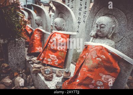 Jizo statues in Arashiyama temple, Kyoto, Japan Stock Photo