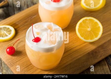 Refreshing Raki Vodka Sour Cocktail with a Cherry Stock Photo