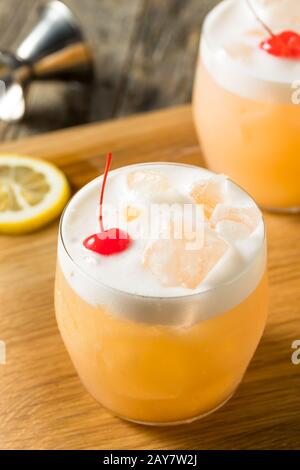 Refreshing Raki Vodka Sour Cocktail with a Cherry Stock Photo