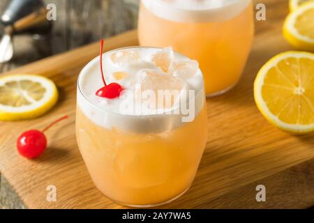 Refreshing Raki Vodka Sour Cocktail with a Cherry Stock Photo
