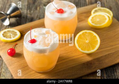 Refreshing Raki Vodka Sour Cocktail with a Cherry Stock Photo