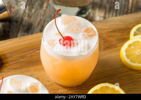 Refreshing Raki Vodka Sour Cocktail with a Cherry Stock Photo