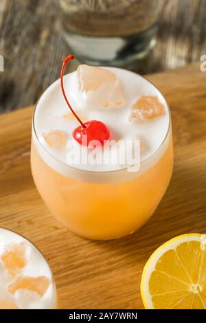 Refreshing Raki Vodka Sour Cocktail with a Cherry Stock Photo