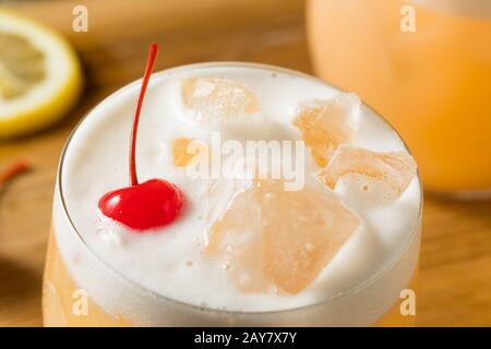 Refreshing Raki Vodka Sour Cocktail with a Cherry Stock Photo