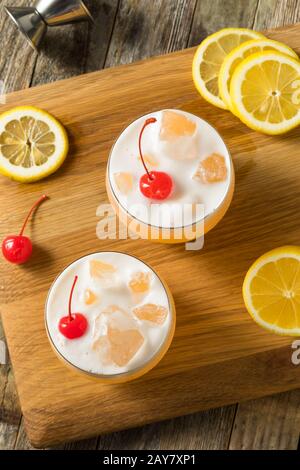 Refreshing Raki Vodka Sour Cocktail with a Cherry Stock Photo