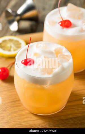 Refreshing Raki Vodka Sour Cocktail with a Cherry Stock Photo