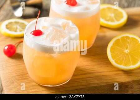 Refreshing Raki Vodka Sour Cocktail with a Cherry Stock Photo