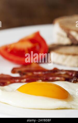 Fried eggs with bacon on a plate Stock Photo