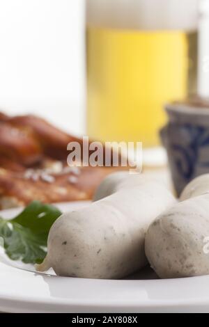 Bavarian white sausages with pretzel Stock Photo