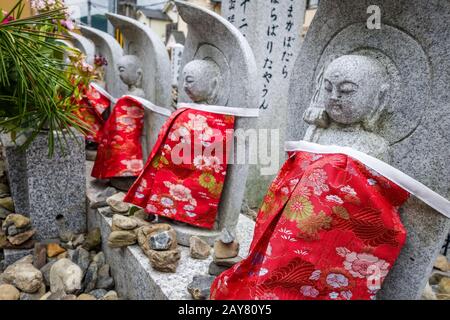Jizo statues in Arashiyama temple, Kyoto, Japan Stock Photo
