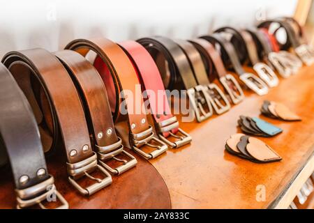 Handmade Leather Belts for sale in a stand of the crafts market