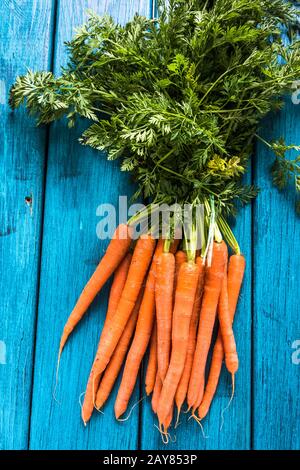 Bunch of fresh vibrant carrots from local market Stock Photo