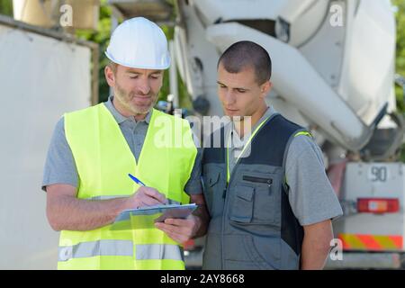 portrait of foreman and supervisor discussing construction site Stock Photo