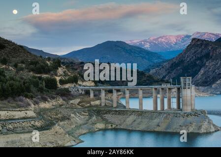 Reservoir Embalse de Canales in Granada, Spain at evening Stock Photo