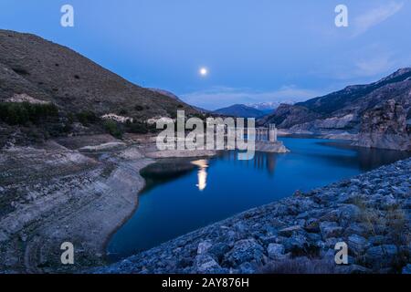 Reservoir Embalse de Canales in Granada, Spain at evening Stock Photo