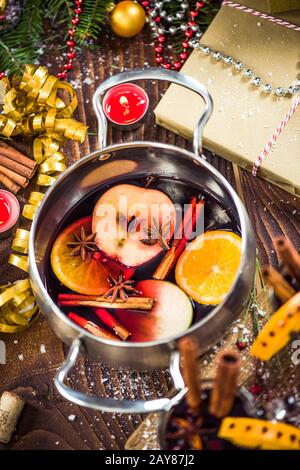 Spices and mulled wine in pot Stock Photo