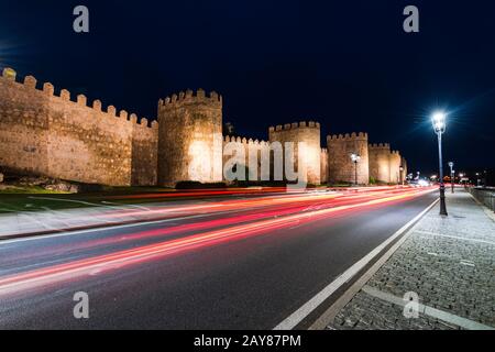 Light trials of cars and Avila walls in background Stock Photo