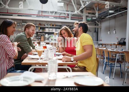two couples having a good time in restauran. Lesiure, friendship Stock Photo