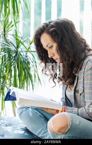 young casual girl reading book Stock Photo