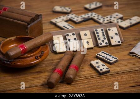 Cigars in ash tray on table Stock Photo